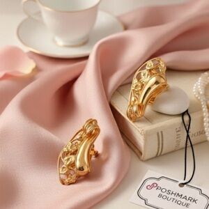 Statement twisted large chunky gold tone clip on earrings